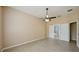 Spacious main bedroom with a ceiling fan and an ensuite bathroom with double doors at 5340 Riva Ridge Dr, Wesley Chapel, FL 33544