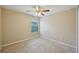 Comfortable bedroom featuring tile flooring and a ceiling fan at 5340 Riva Ridge Dr, Wesley Chapel, FL 33544