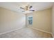 Neutral bedroom with tile flooring and a ceiling fan at 5340 Riva Ridge Dr, Wesley Chapel, FL 33544