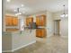 Kitchen with wooden cabinets, granite countertops, and a breakfast bar perfect for gatherings at 5340 Riva Ridge Dr, Wesley Chapel, FL 33544
