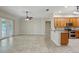 Open-concept kitchen area with tile flooring and wooden cabinets provides ample space at 5340 Riva Ridge Dr, Wesley Chapel, FL 33544