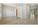 Open living area with arched doorways leading to kitchen and other rooms at 5340 Riva Ridge Dr, Wesley Chapel, FL 33544