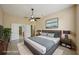 Spacious main bedroom with neutral paint, ceiling fan, and view into ensuite bathroom at 5340 Riva Ridge Dr, Wesley Chapel, FL 33544