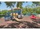 Community playground featuring multiple play structures, slides, and swing sets at 5340 Riva Ridge Dr, Wesley Chapel, FL 33544