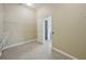 Large walk-in closet with ample storage and open doorway to ensuite bathroom at 5340 Riva Ridge Dr, Wesley Chapel, FL 33544