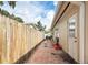 Backyard space with a worn brick patio and wood fence at 5542 19Th N Ave, St Petersburg, FL 33710
