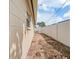 Narrow backyard space between the house and white fence at 5542 19Th N Ave, St Petersburg, FL 33710