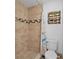 Modern bathroom with beautiful tile and a shower with glass doors and a shower curtain at 5542 19Th N Ave, St Petersburg, FL 33710