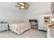 Bedroom with a bed, dresser, and desk, illuminated by a modern ceiling fan for added comfort at 5542 19Th N Ave, St Petersburg, FL 33710