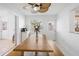 Bright dining area with a wooden table, seating bench, and stylish ceiling fan for a welcoming atmosphere at 5542 19Th N Ave, St Petersburg, FL 33710