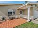Welcoming front porch with outdoor seating and a brick-paved patio, perfect for relaxing at 5542 19Th N Ave, St Petersburg, FL 33710