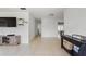 Bright living room boasting sleek tiled floors and a versatile layout for modern living at 5542 19Th N Ave, St Petersburg, FL 33710