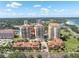 Beautiful aerial view of luxury condos featuring manicured landscaping, a pool, and interconnected buildings at 555 5Th Ne Ave # 1032, St Petersburg, FL 33701