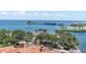 Scenic aerial view of a waterfront property with palm trees and a tranquil pier at 555 5Th Ne Ave # 1032, St Petersburg, FL 33701