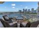 Enjoy breathtaking views from this condo's spacious balcony with comfortable seating overlooking the beautiful marina and city skyline at 555 5Th Ne Ave # 1032, St Petersburg, FL 33701
