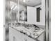 Modern bathroom featuring granite countertops, sleek vanity, and contemporary fixtures at 555 5Th Ne Ave # 1032, St Petersburg, FL 33701