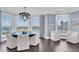 Elegant dining room featuring bay windows, a modern chandelier and stunning waterfront views at 555 5Th Ne Ave # 1032, St Petersburg, FL 33701