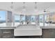 Well-appointed kitchen with a large island, modern lighting fixtures, and stunning panoramic views at 555 5Th Ne Ave # 1032, St Petersburg, FL 33701