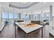 Chef's dream kitchen with marble countertops, large island, stainless steel appliances, and panoramic water views at 555 5Th Ne Ave # 1032, St Petersburg, FL 33701