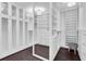 Spacious walk-in closet features custom built-ins, shelves, drawers, and mirrors for ample storage at 555 5Th Ne Ave # 1032, St Petersburg, FL 33701