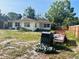 Backyard featuring a trailer, grill, and building at 5805 Tennessee Ave, New Port Richey, FL 34652