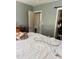 A bedroom featuring closet, walls, and an entrance to the bathroom at 5805 Tennessee Ave, New Port Richey, FL 34652