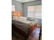 Bedroom featuring a bed, wood-look floors, and natural light at 5805 Tennessee Ave, New Port Richey, FL 34652