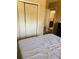This is a bedroom with a closet and an entrance to the bathroom at 5805 Tennessee Ave, New Port Richey, FL 34652