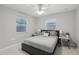 Relaxing bedroom with soft lighting, ceiling fan, and comfortable queen sized bed at 6149 37Th N Ave, St Petersburg, FL 33710