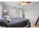 Well-lit bedroom features a ceiling fan, closet, and en-suite bathroom at 6149 37Th N Ave, St Petersburg, FL 33710