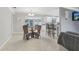 A naturally bright dining area with a glass table is visible from the kitchen and living room at 6149 37Th N Ave, St Petersburg, FL 33710