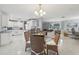 Open-concept design shows the dining room, kitchen, and living room creating a cohesive living space at 6149 37Th N Ave, St Petersburg, FL 33710