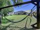 Lush backyard with hammock, screened-in pool, and comfortable outdoor setting at 6205 Chapel Pines Blvd, Wesley Chapel, FL 33545