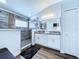This bathroom has double vanities and a walk-in shower with decorative tile at 6205 Chapel Pines Blvd, Wesley Chapel, FL 33545