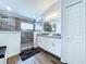 This bathroom has double vanities and a walk-in shower with decorative tile at 6205 Chapel Pines Blvd, Wesley Chapel, FL 33545