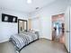 Bedroom with wood-look floors and murphy bed provides a versatile design at 6205 Chapel Pines Blvd, Wesley Chapel, FL 33545