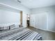 Bedroom with wood-look floors and sliding closet doors provides a seamless design at 6205 Chapel Pines Blvd, Wesley Chapel, FL 33545