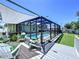 Spacious deck featuring comfortable seating and views of the screened pool, ideal for outdoor entertaining at 6205 Chapel Pines Blvd, Wesley Chapel, FL 33545