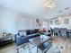 Bright living room with wood floors, comfortable seating, and a decorative chandelier at 6205 Chapel Pines Blvd, Wesley Chapel, FL 33545
