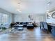 Open-concept living and dining area with modern furnishings and plenty of natural light at 6205 Chapel Pines Blvd, Wesley Chapel, FL 33545
