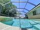 Sparkling pool within a screened enclosure, ideal for year-round enjoyment and relaxation in a private setting at 6205 Chapel Pines Blvd, Wesley Chapel, FL 33545