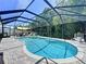 Resort-style pool area with a heated spa, a spacious screened enclosure, and ample room for lounging and entertaining at 6205 Chapel Pines Blvd, Wesley Chapel, FL 33545