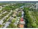 A high angle aerial view showing home in a densely populated residential neighborhood near a lake at 6232 Crickethollow Dr, Riverview, FL 33578