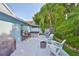 A spacious backyard featuring a hot tub, outdoor seating, and lush tropical landscaping for a private oasis at 6232 Crickethollow Dr, Riverview, FL 33578