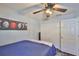 Comfortable bedroom with hardwood floors, ceiling fan, closet, and relaxing decor at 6232 Crickethollow Dr, Riverview, FL 33578