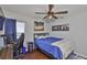 Comfortable bedroom with hardwood floors, ceiling fan, window with blinds, and relaxing decor at 6232 Crickethollow Dr, Riverview, FL 33578