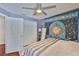 Comfortable bedroom with hardwood floors, closet, and relaxing decor at 6232 Crickethollow Dr, Riverview, FL 33578