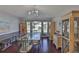 Elegant dining room featuring dark hardwood floors, stylish furnishings, and ample natural light at 6232 Crickethollow Dr, Riverview, FL 33578