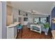 Bright living room offering a view of kitchen bar seating area and open view to the screened-in porch at 6232 Crickethollow Dr, Riverview, FL 33578