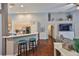 Open floor plan with sight lines from the living room to the kitchen, breakfast bar, and hallway at 6232 Crickethollow Dr, Riverview, FL 33578